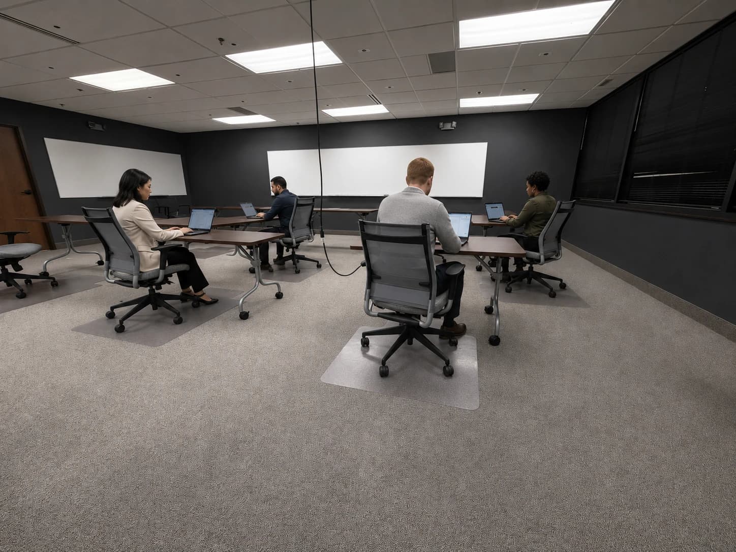 Desks and chairs at the front of the training room